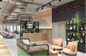 Open-plan office reception with green wall, lounge seating and exposed ceiling