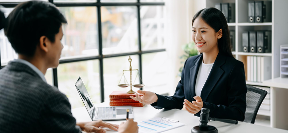 Property consultant meeting a client at an office desk