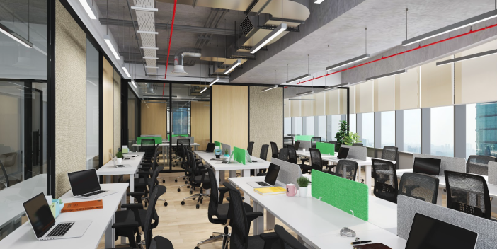 Large open-plan office with rows of workstations