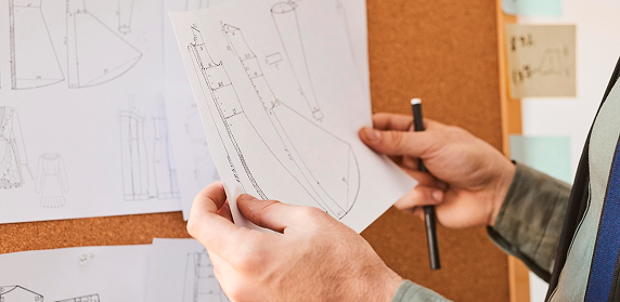 Designer reviewing architectural drawings