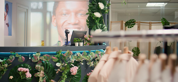 Retail unit in a shopping mall with clothing and floral displays