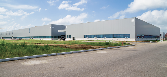 Industrial warehouse building on development land
