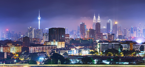 Kuala Lumpur skyline at night with KL Tower and Petronas Twin Towers
